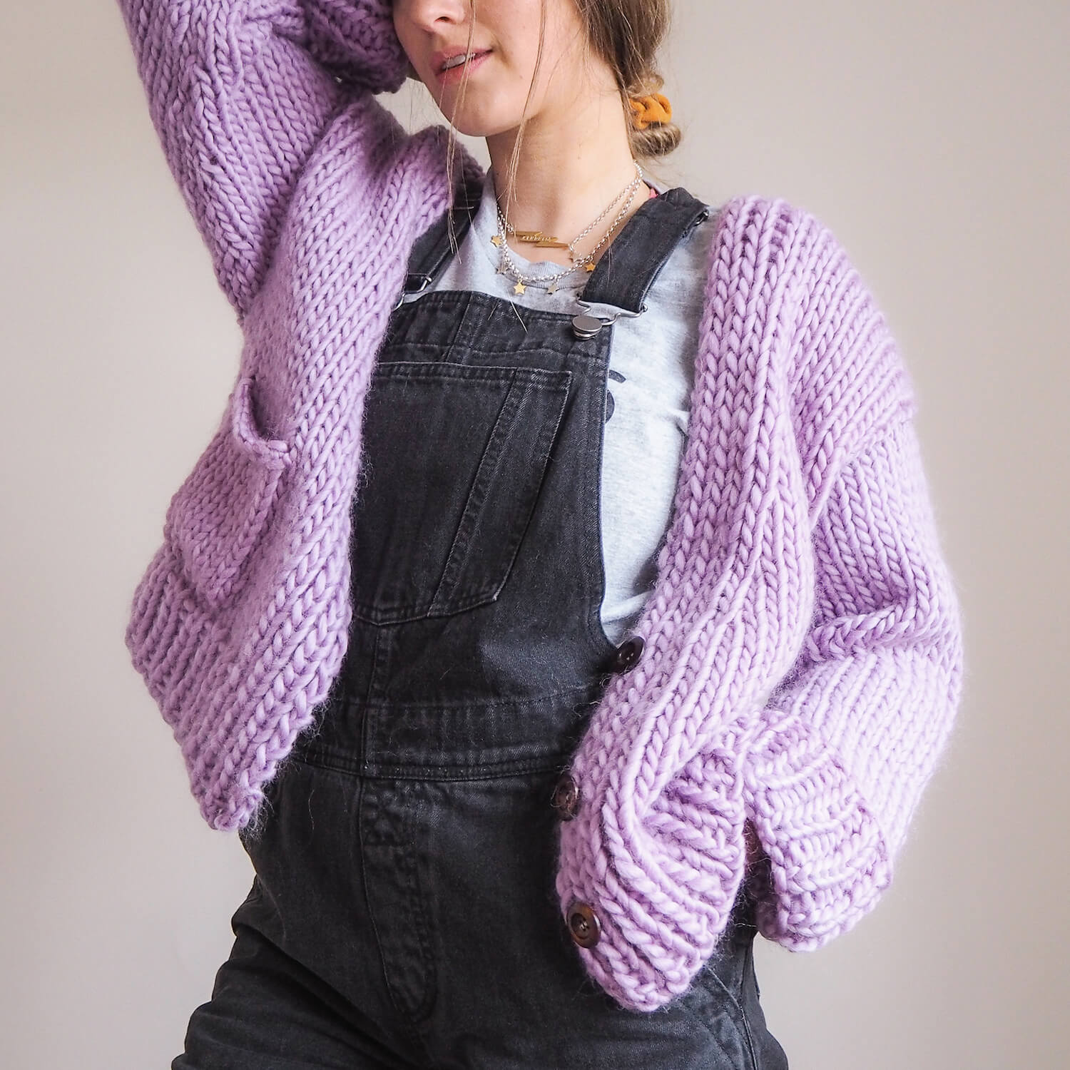 buttoning a cardigan