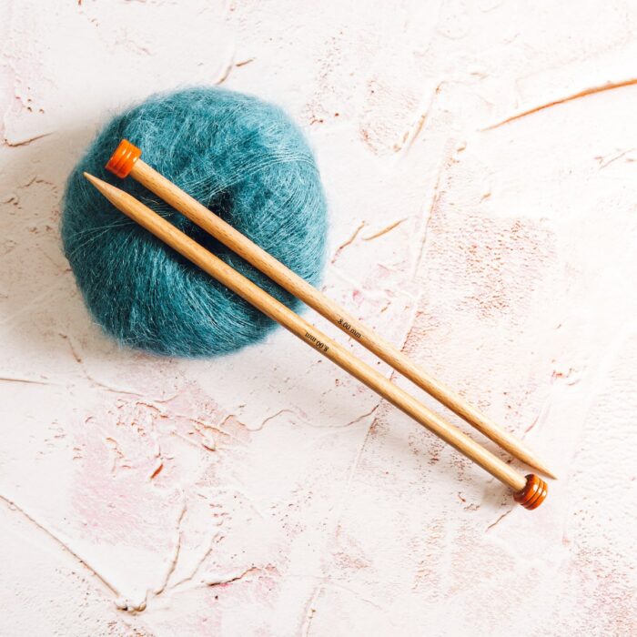 petrol blue Mini Mohair knitting yarn by Lauren Aston Designs and knitting needles